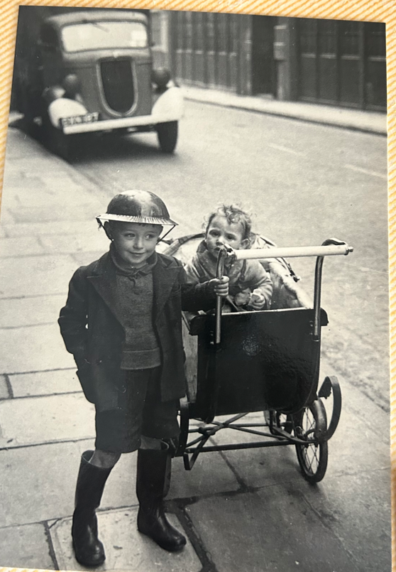 boy with little girl in pram