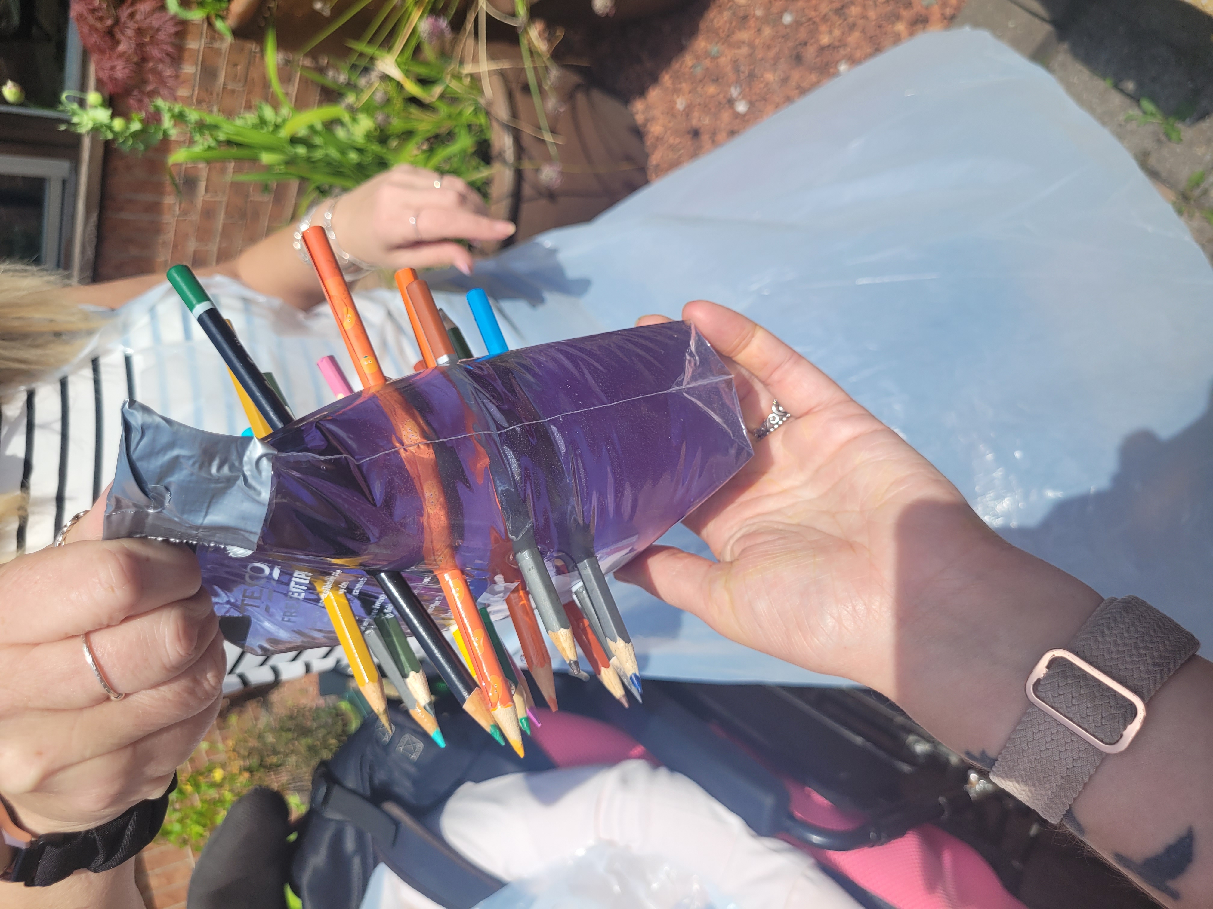 pencils through bag of water